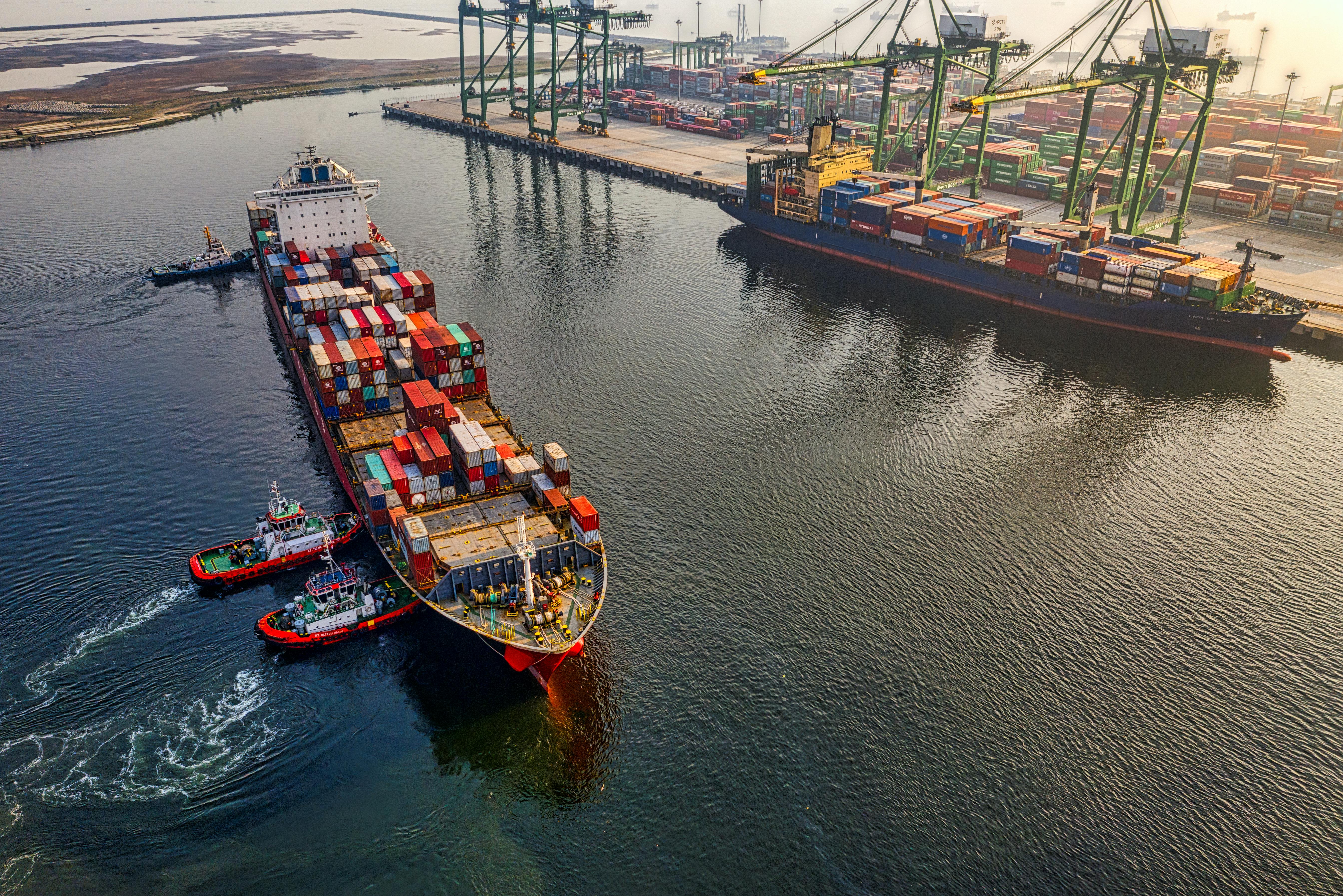 Modern port operations with container cranes and cargo vessels